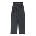 Black wide-leg streetwear pants with elastic waistband and drawstring, modern urban style