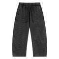 Black washed streetwear jogger pants with elastic waistband and stitched details, front view