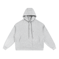 Light grey oversized streetwear hoodie with front pockets and drawstring hood on white background