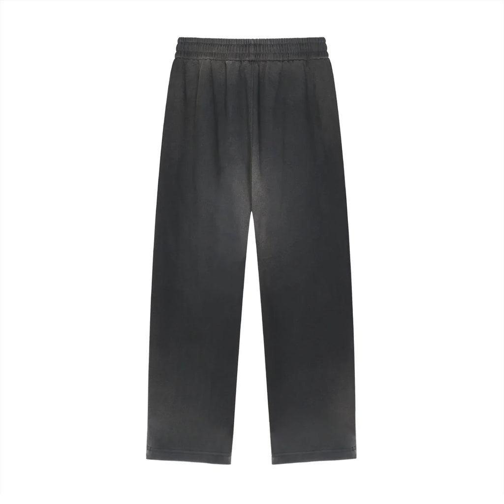 Classic black streetwear pants with elastic waistband, relaxed fit, and modern urban style