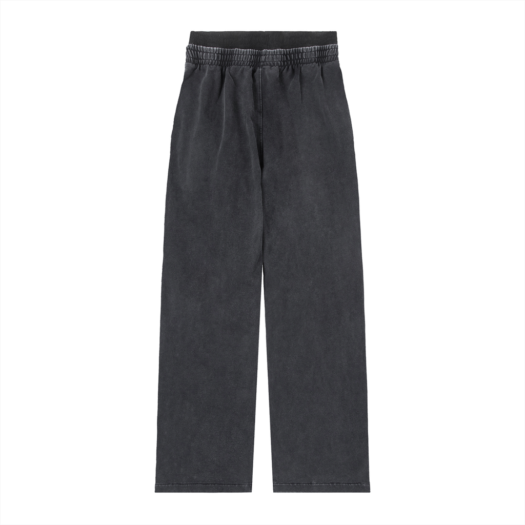 Black oversized streetwear pants with elastic waistband on white background