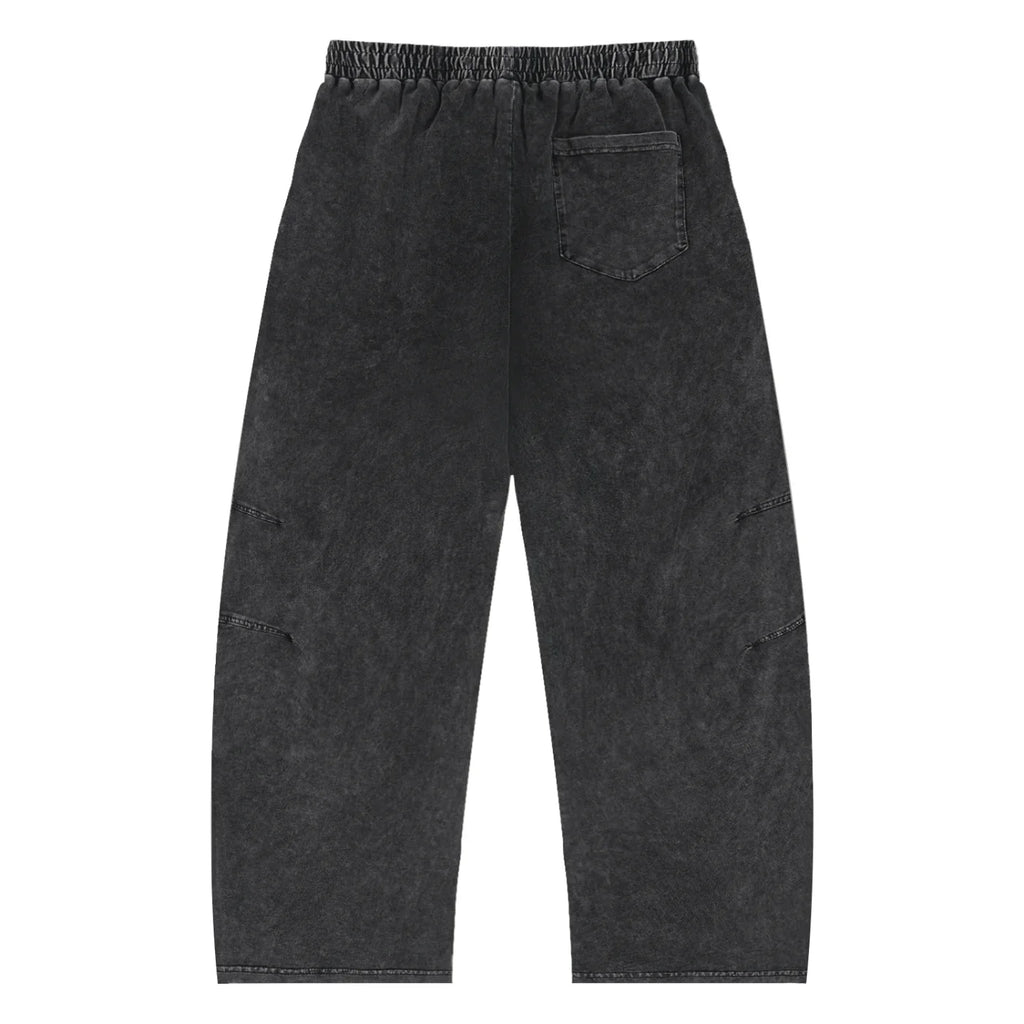 Black washed streetwear pants with elastic waistband and single back pocket, urban style