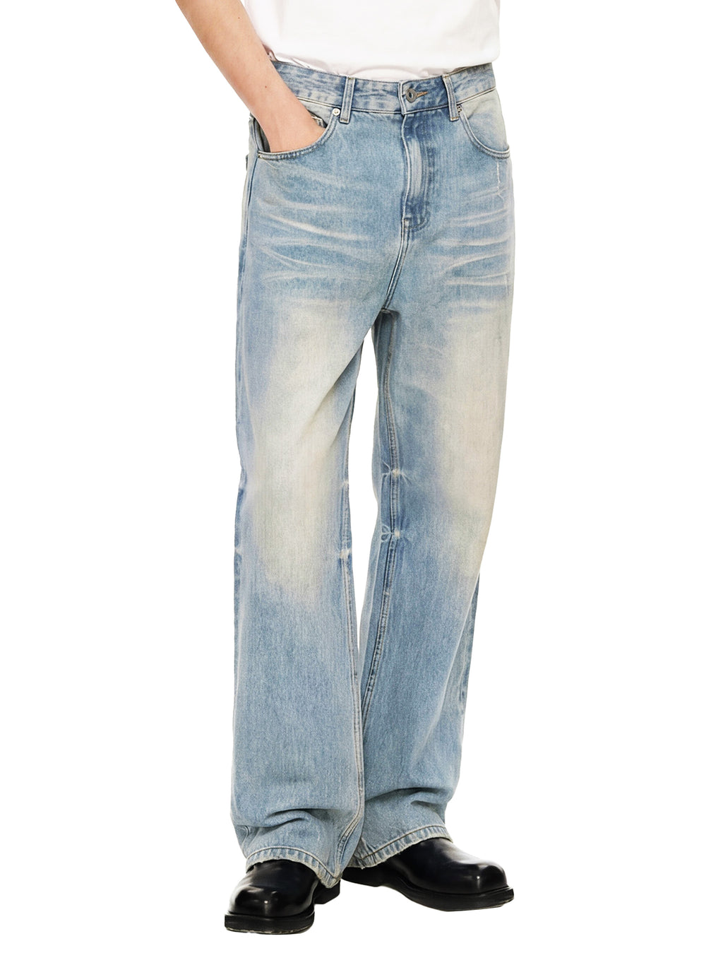 Light blue baggy jeans with a faded wash, worn by a standing model in black shoes